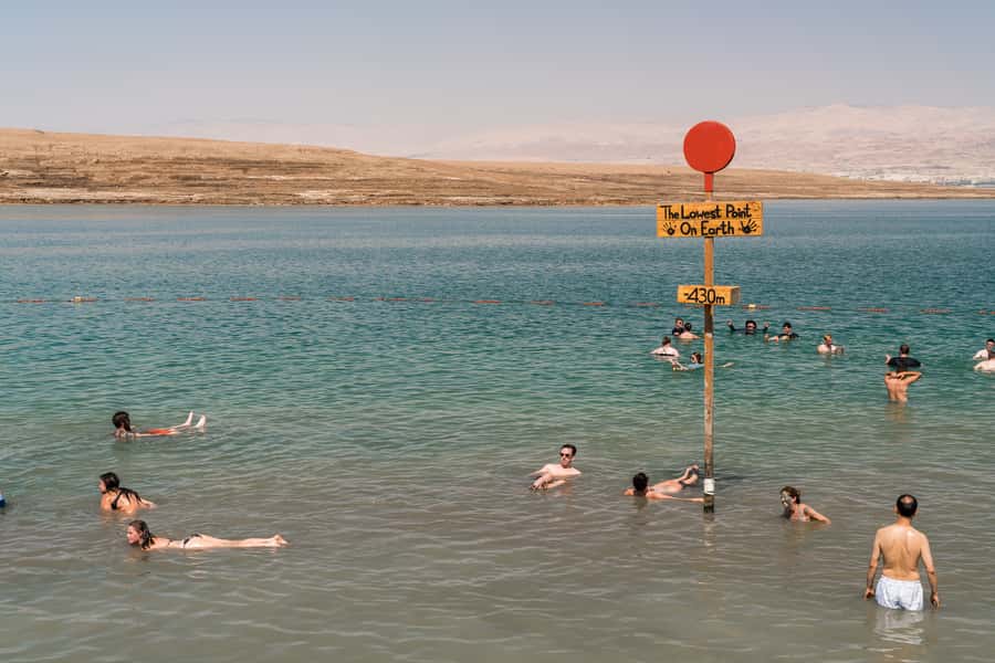 Dead Sea Full-Day Trip from Tel Aviv - Floating in water that is 8.6 times saltier