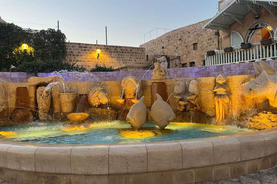 Jaffa: Old City, Port & Shuk Hapishpishim Walking Tour - Kdumim Square: cafes, shops, and the everyday side of Jaffa