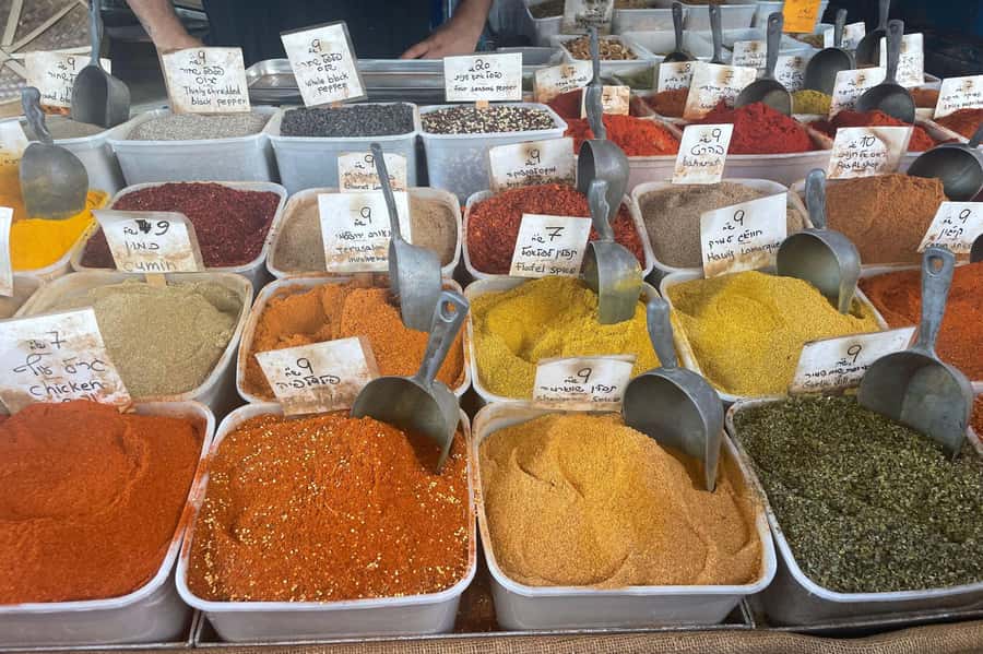 Tel Aviv: Carmel Market & Neighborhood Guided Walking Tour - Shuk HaCarmel stalls: spices, produce, and the real aroma lesson